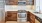 a kitchen with wooden cabinets
