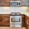 a kitchen with wooden cabinets