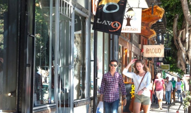 people walking on a sidewalk