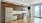 a kitchen with wooden cabinets