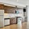 a kitchen with wooden cabinets