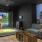 a group of people in a golf simulator