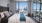 Large well lit bedroom with plush carpets and large windows 