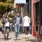 people walking down a sidewalk