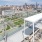 a rooftop of a building with a city in the background
